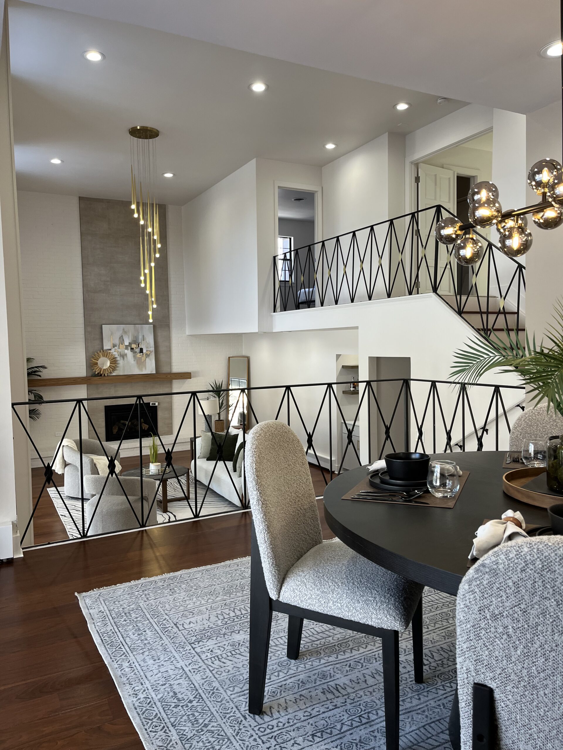 Open-concept interior featuring updated flooring, modern lighting, and freshly painted walls.