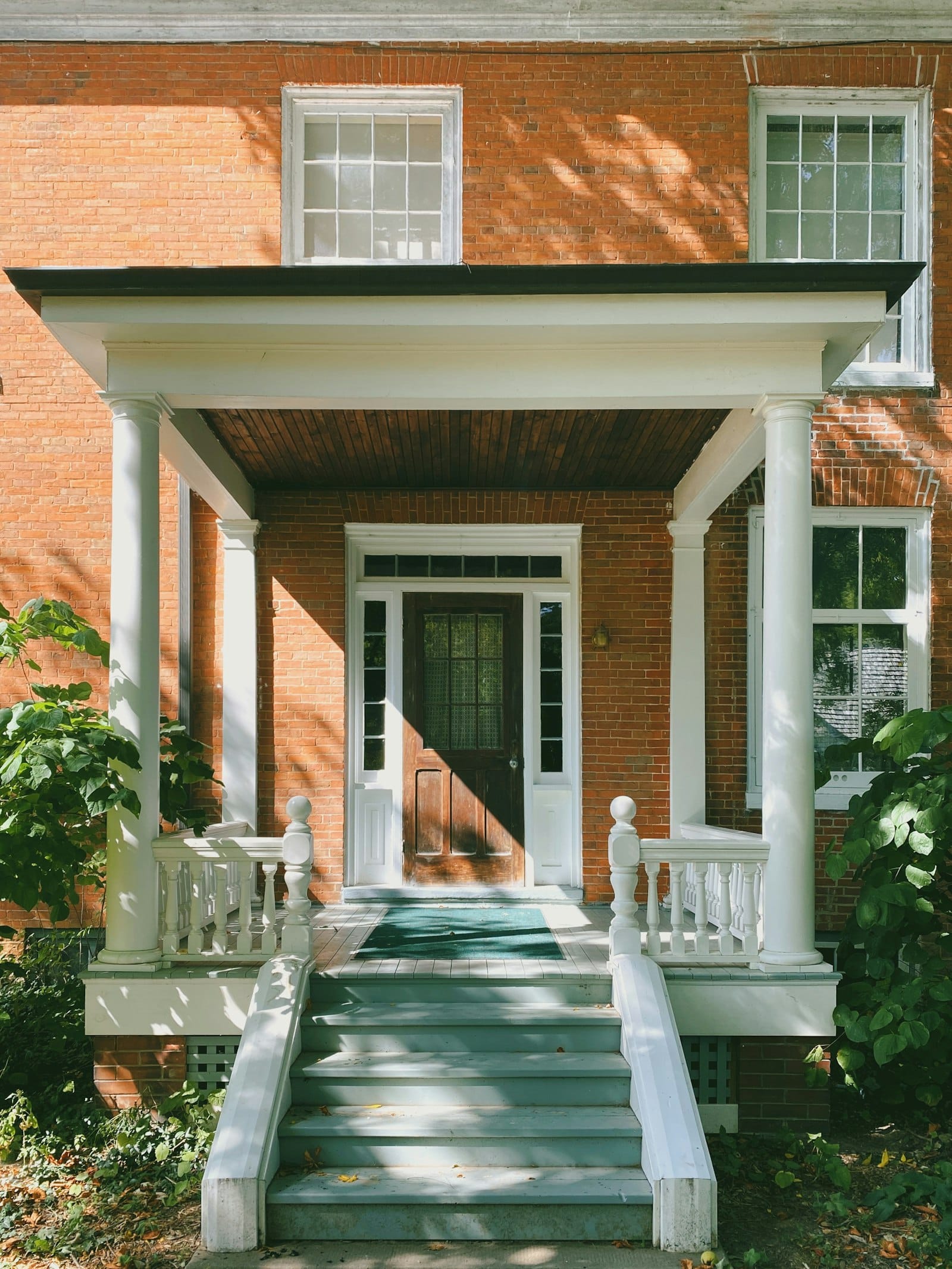Residential front entry door on a brick home exterior
